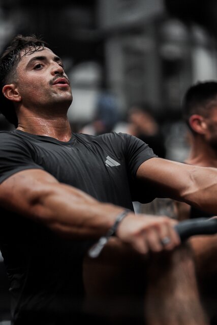 An athlete uses a rowing machine in the Endurance Zone