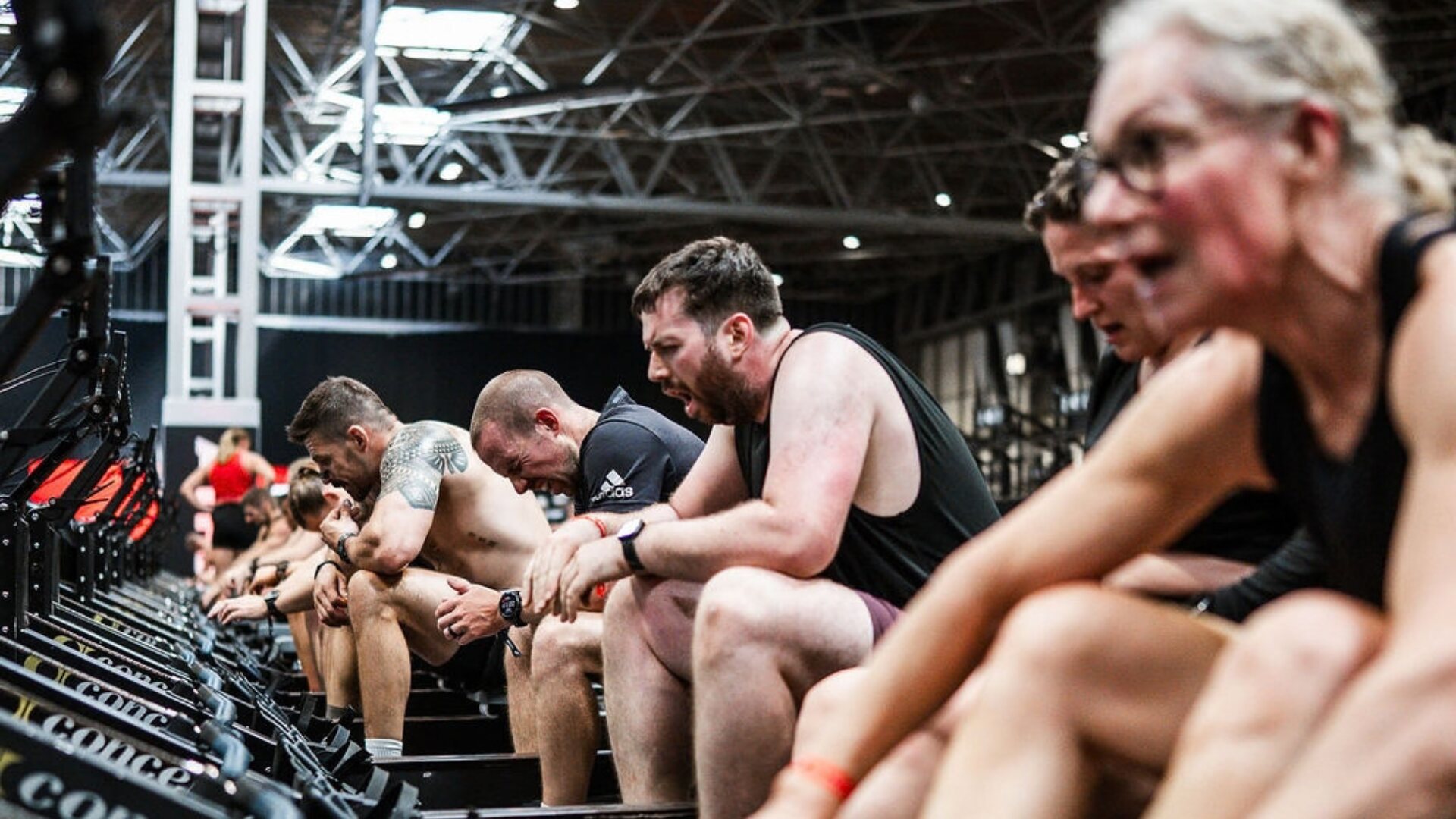 Athletes of all ages dig in on the rowing machines during the Endurance workout